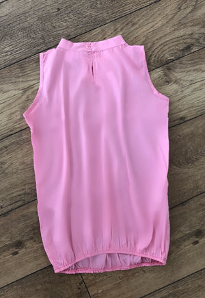 Pink maternity sleeveless blouse fashionably pregnant